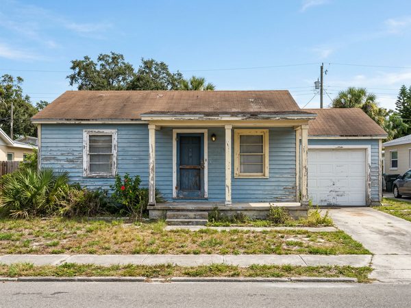 Older house exterior with faded weathered paint needing a refresh